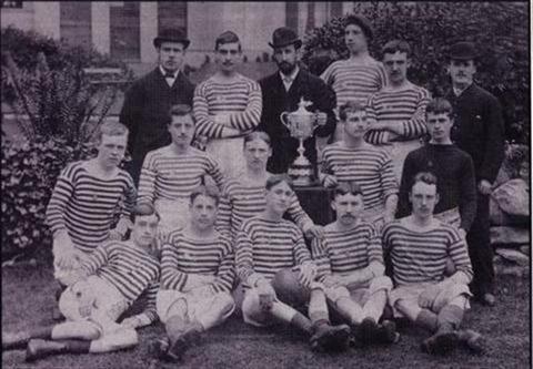 The successful West Bromwich Albion side with the original trophy won in 1883